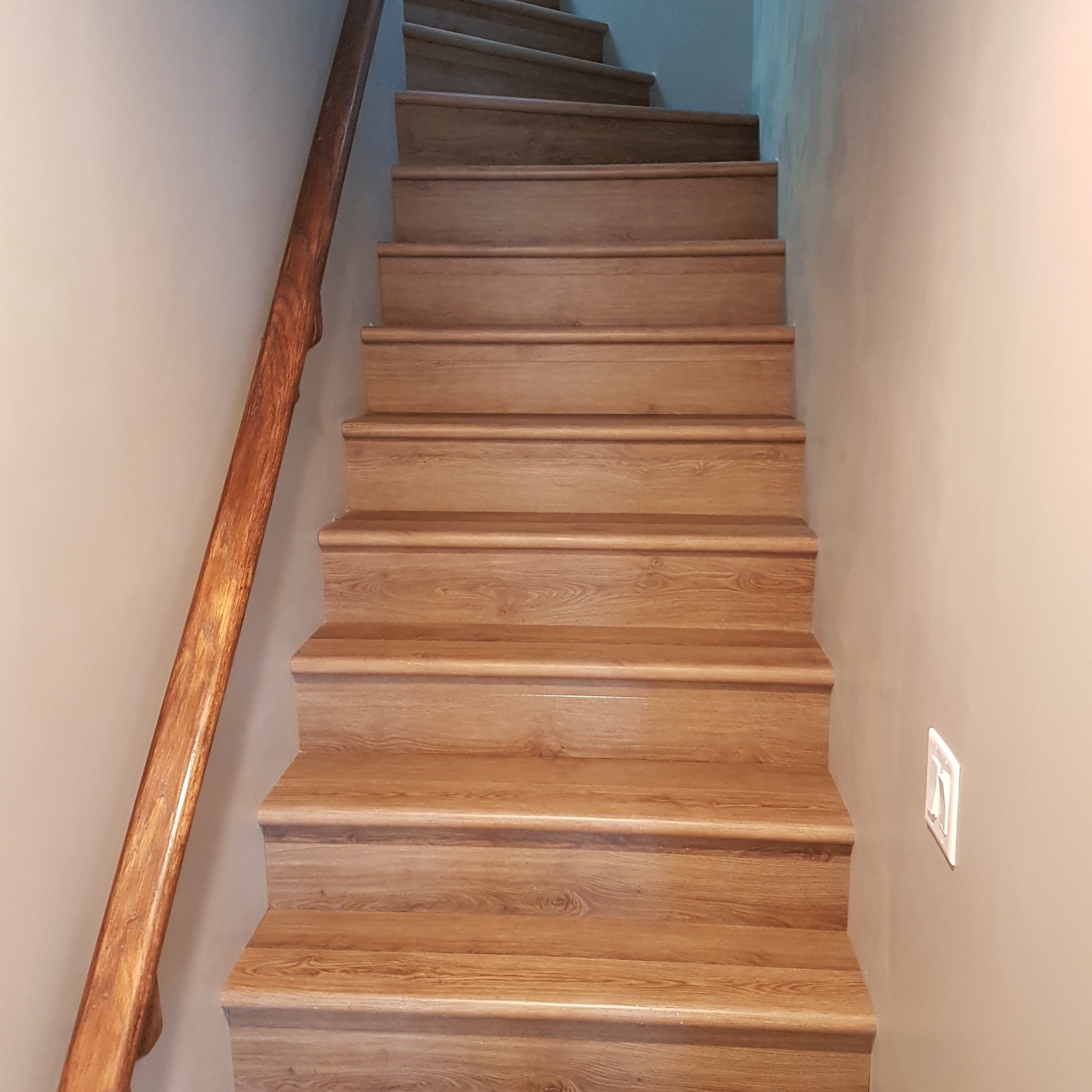 Custom basement staircase with wood treads