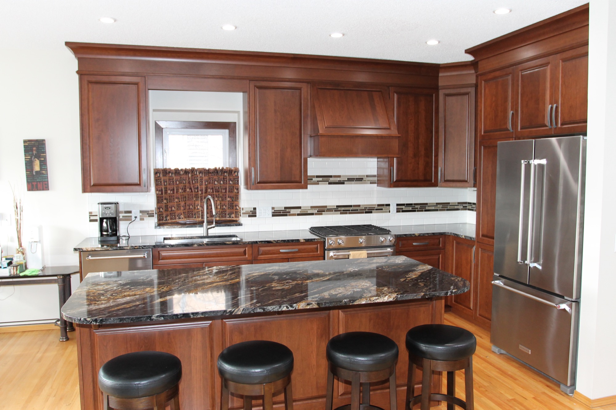Full L-shaped kitchen with island and pendant lighting